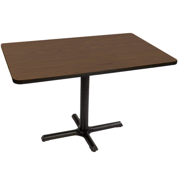 A rectangular Correll table with a walnut finish top and black base.