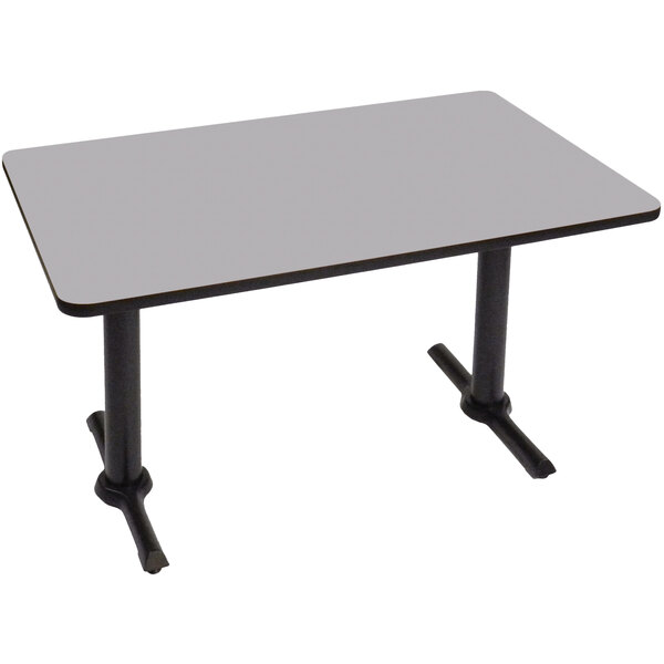 A white rectangular Correll table with gray granite finish and two black T bases.