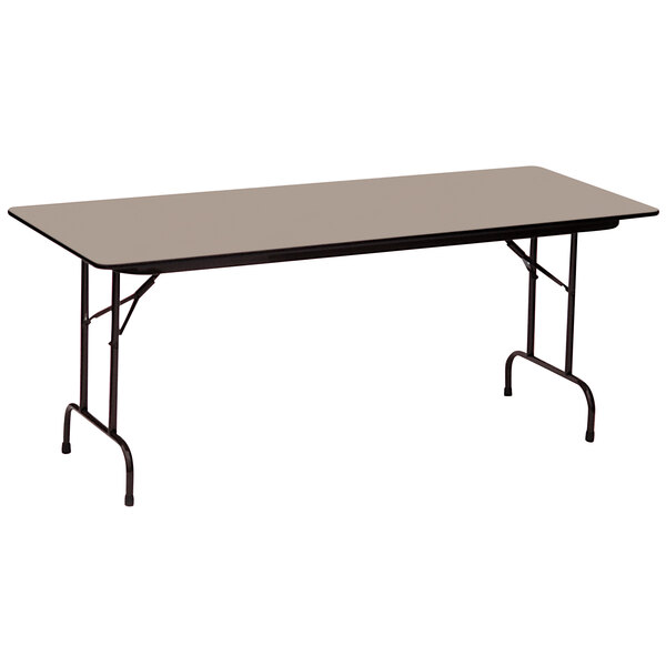 A rectangular Correll folding table with a black frame.