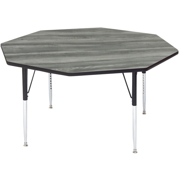 A grey wood octagon table with metal legs.