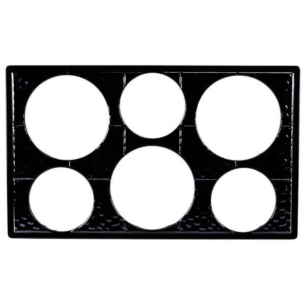 A black melamine adapter plate with six round cut-outs.