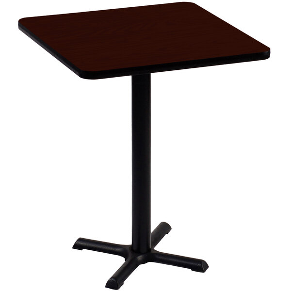 A Correll square table with a black base and mahogany top.