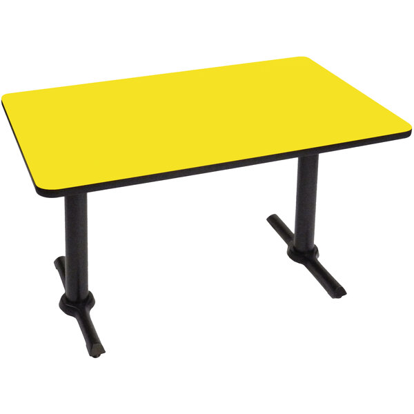 A yellow rectangular Correll table with black T bases.