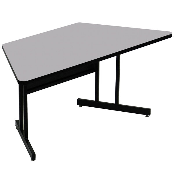 A trapezoid gray granite Correll desk with a black base.