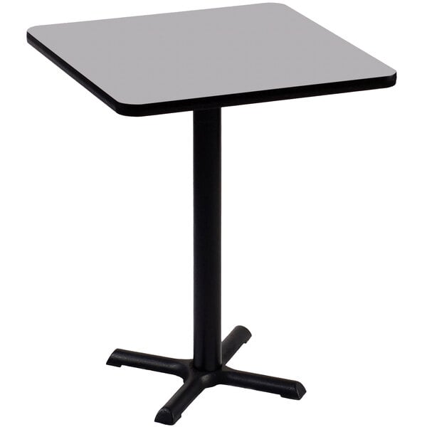 A Correll square table with a gray granite top and black base.