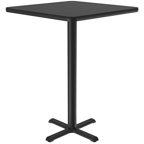 A Correll black granite finish square bar height table with a metal base.