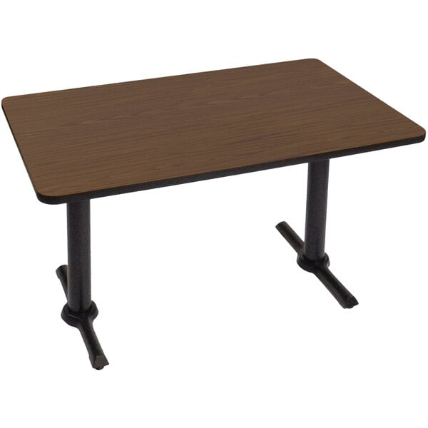 A brown rectangular Correll cafe table with black T bases.