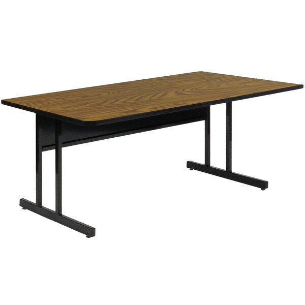 A brown rectangular table with black metal legs.