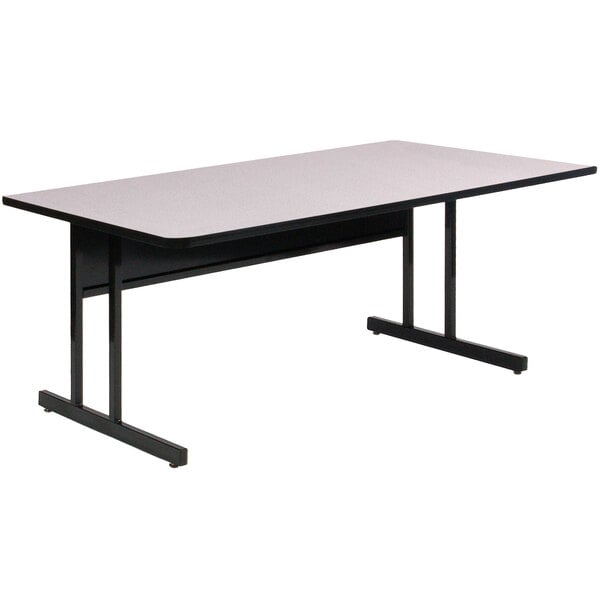 A white rectangular Correll computer table with black legs.