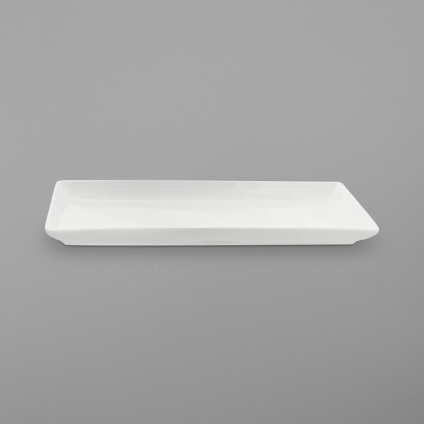 A white rectangular porcelain platter with a small handle.