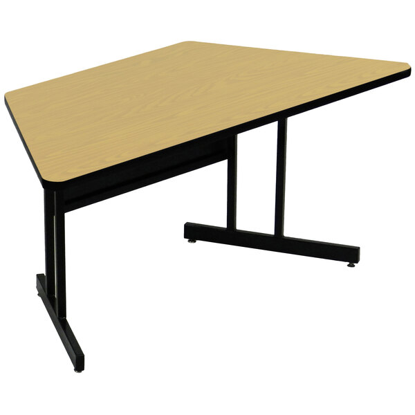A Correll trapezoid computer table with a black base and a wood finish top.