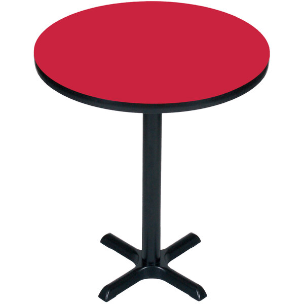 A red Correll bar height table with a black base and pole.
