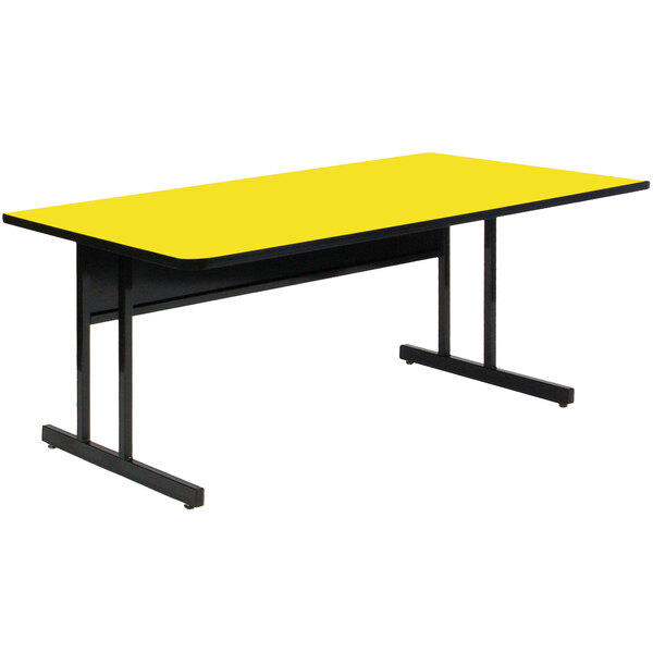 A yellow rectangular table with black legs.