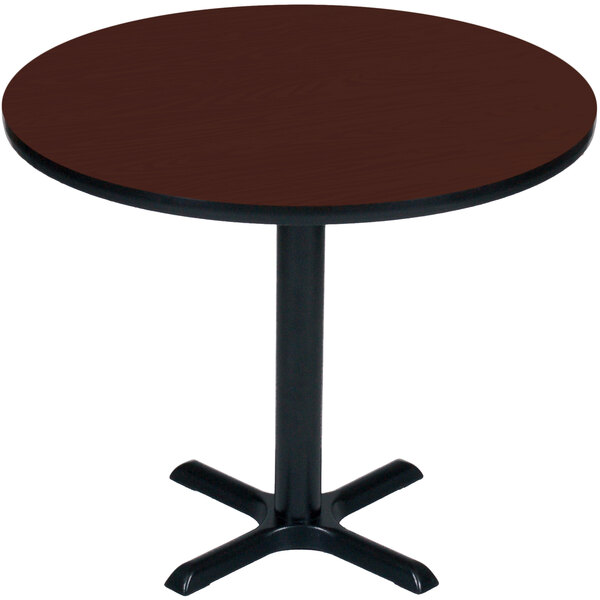 A Correll round bar height table with a brown top and black base.