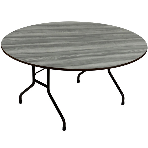 A Correll round folding table with metal legs and a gray top.