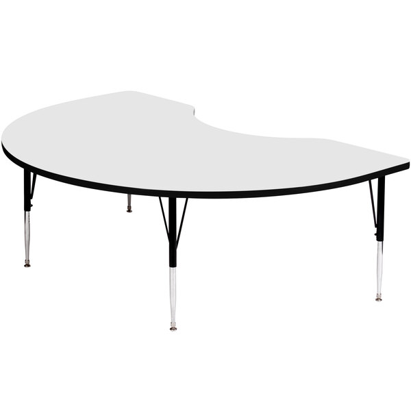 A white kidney-shaped activity table with black legs.
