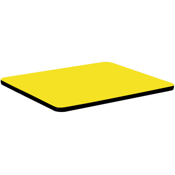 A yellow square Correll high pressure table top with black edges.
