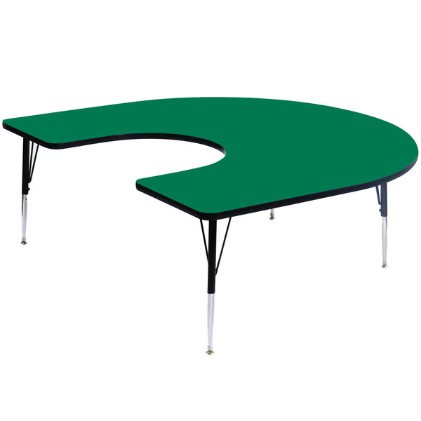 A green half-moon shaped Correll activity table with adjustable height.