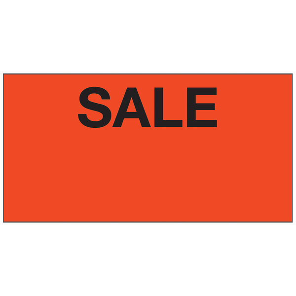A red rectangular sign with black "SALE" text over a black and orange rectangular object.