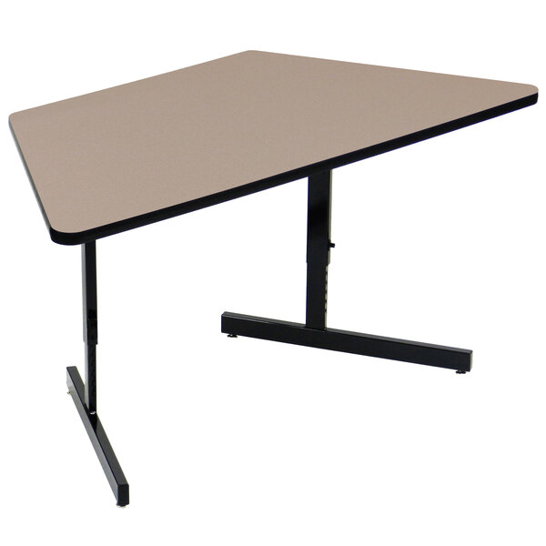 A Correll trapezoid computer table with a black base.