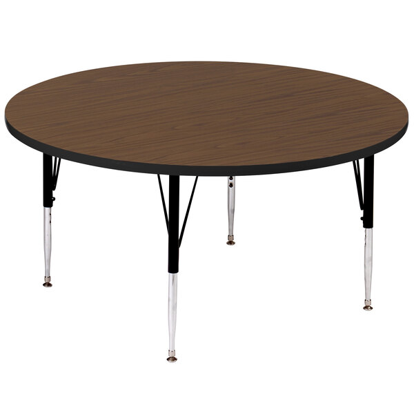 A Correll round walnut activity table with black legs.