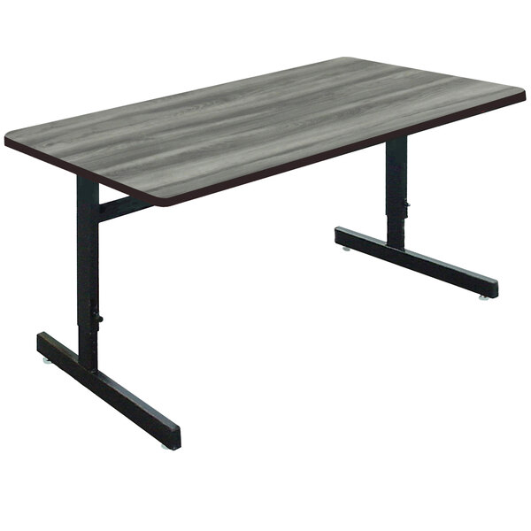 A Correll rectangular computer table with a New England Driftwood top and a black metal frame.