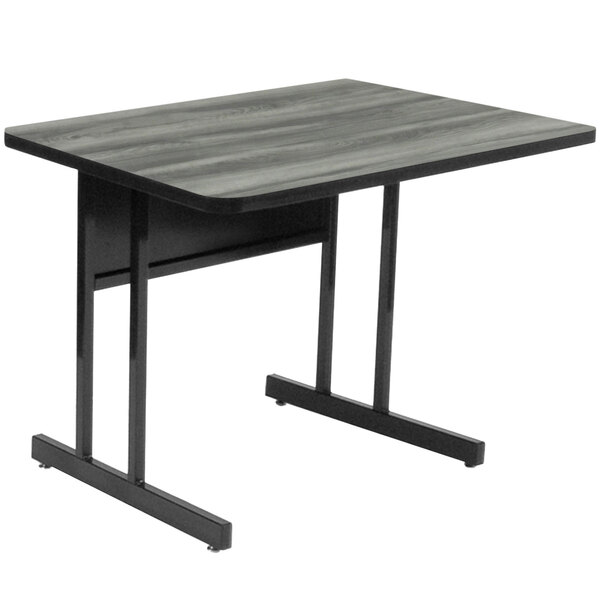 A black rectangular Correll computer table with metal legs.