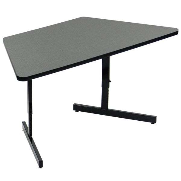 A black trapezoid computer table with a black base.