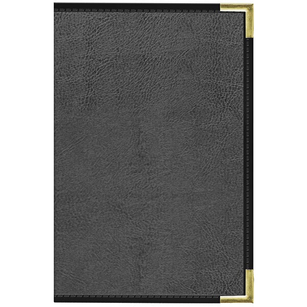 A black leather book with gold corners.