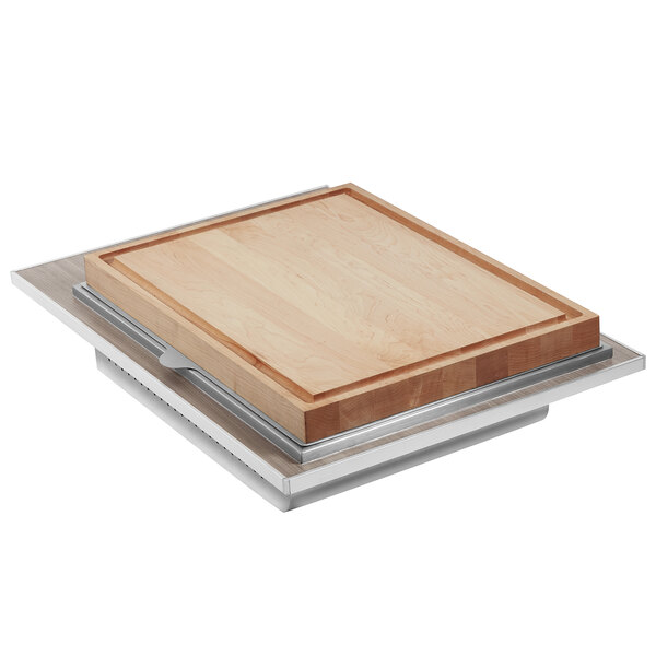 An Eastern Tabletop grey grain drop-in carving station tile with a wooden cutting board on a metal tray.
