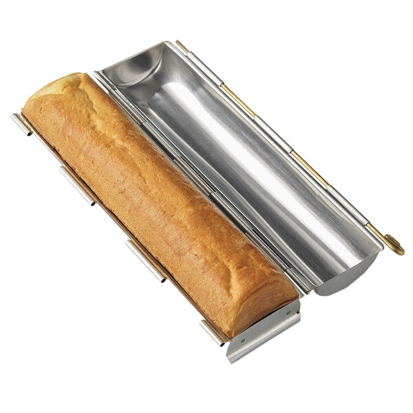 A Matfer Bourgeat stainless steel round bread pan holding a loaf of bread.