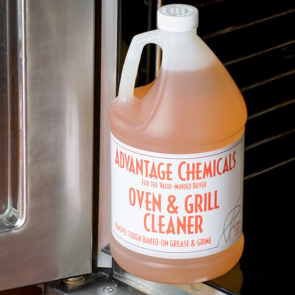 A case of 4 Advantage Chemicals bottles of pink liquid oven and grill cleaner on a counter.