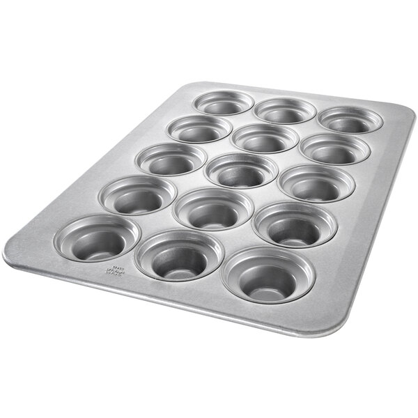 A Chicago Metallic Jumbo Crown Muffin Pan with 15 holes.