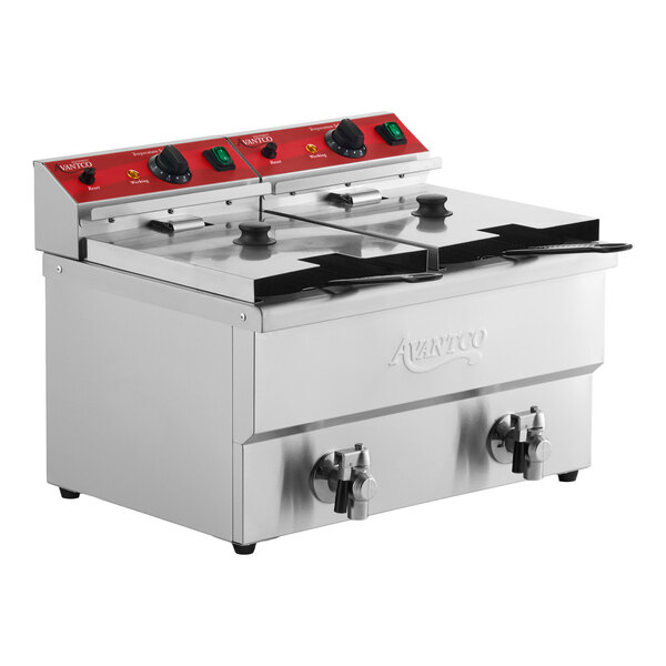 A stainless steel dual tank electric countertop fryer with two control panels, two lids, and two drain valves.