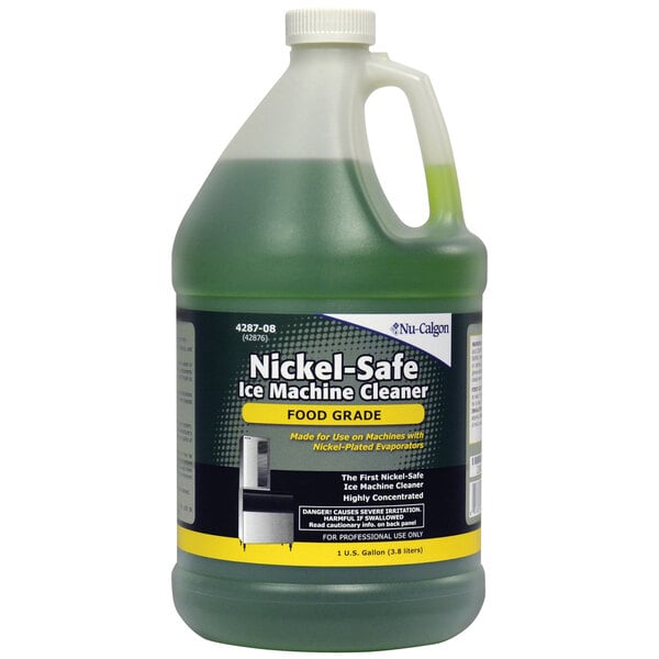 A jug of Nu-Calgon nickel-safe ice machine cleaner on a school kitchen counter.