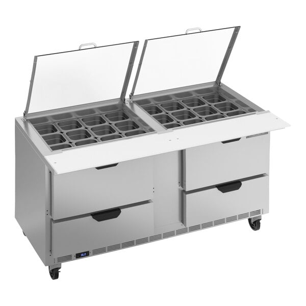 A Beverage-Air refrigerated sandwich prep table with clear lids open over trays.