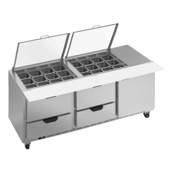 A Beverage-Air refrigerated sandwich prep table with clear lids over square holes.
