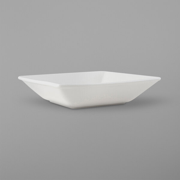A Tuxton square white bowl on a white background.