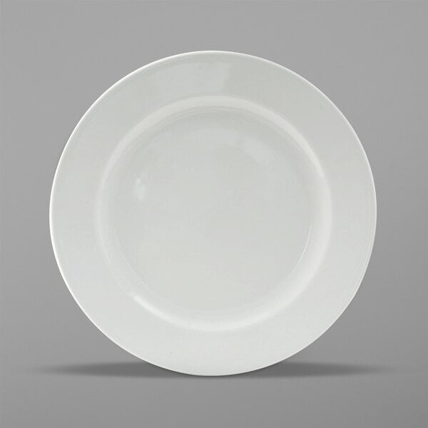 A Tuxton Alaska bright white wide rim plate on a white background.
