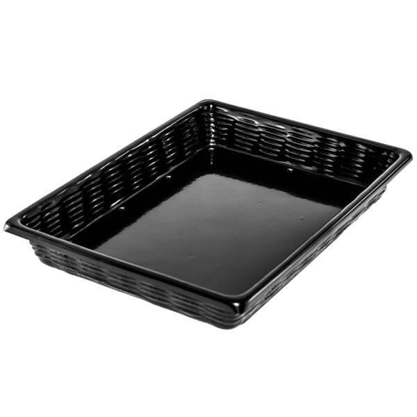 A black Marco Company plastic basket with a wicker-look on a counter.