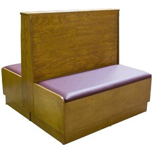 An American Tables & Seating double wood booth with a bead board back and purple cushions.