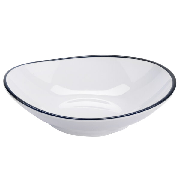A white shallow bowl with black trim.
