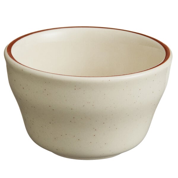 A white narrow rim stoneware bouillon bowl with brown speckled edges.