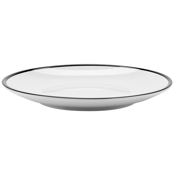 A close up of a GET Settlement white melamine coupe plate with a black rim.