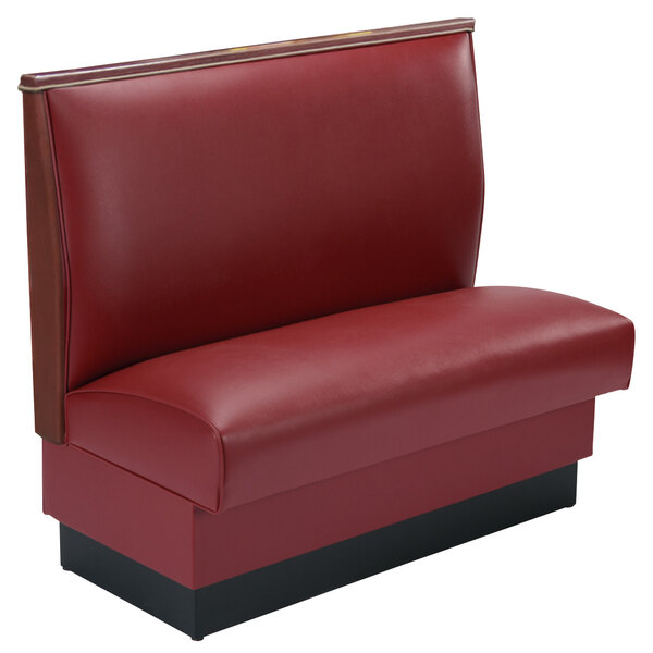 An American Tables & Seating red upholstered booth with black wood accents.