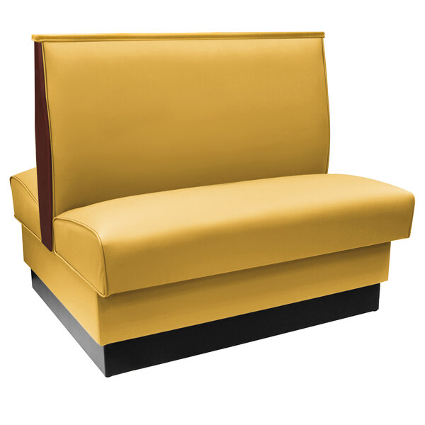 An American Tables & Seating Husk fully upholstered booth with yellow and black upholstery and wood end caps.