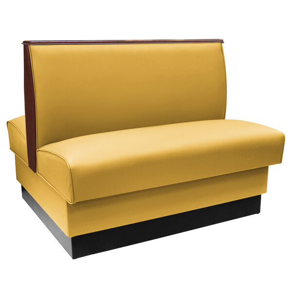 An American Tables & Seating yellow and black fully upholstered booth with wood end and top caps.