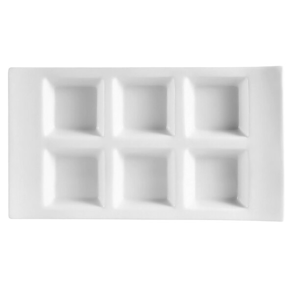 A white rectangular porcelain tray with six square compartments.
