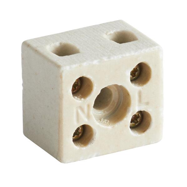 A white terminal block cube with holes in it.