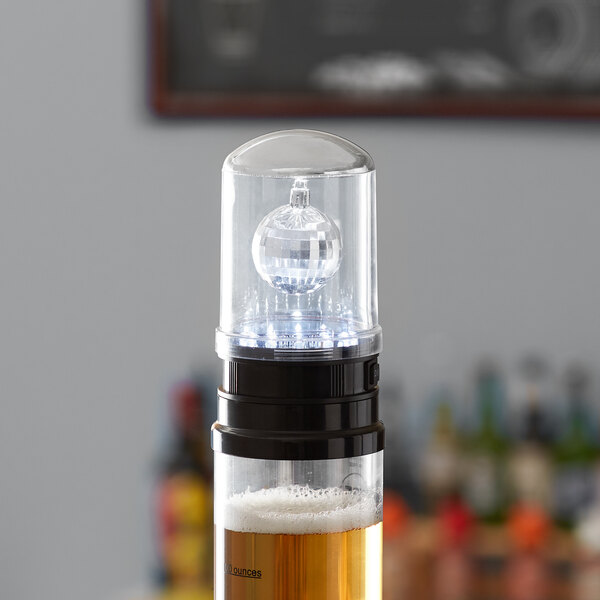 A clear plastic Beer Tubes lighted lid with a clear ball on top.